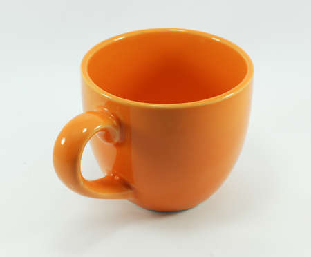Orange coffee mug With a white background.の写真素材