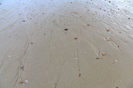 Water flow in the sandの写真素材