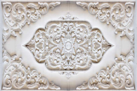 Background texture stucco wall Thailand religion;Traditional Thai style pattern decorative ; stucco  in temple,Thailand.の写真素材