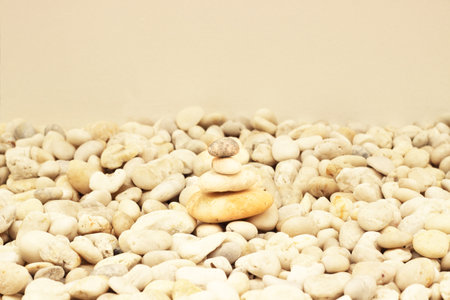 Stack of round smooth stones on a seashoreの写真素材