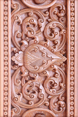Pattern of flower carved on wood backgroundの写真素材