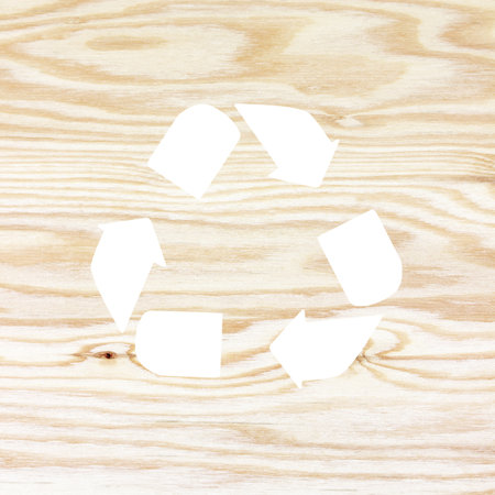wooden texture with recycle symbolの写真素材