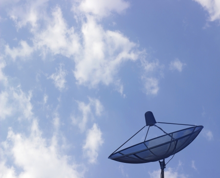 The satellite dish with the blue sky backgroundの写真素材