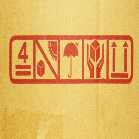 Cardboard box background with symbolの写真素材
