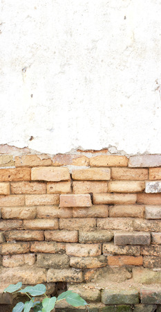 old cracked concrete vintage brick wall backgroundの写真素材