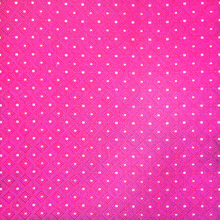 Seamless pink and white polka fabric backgroundの写真素材