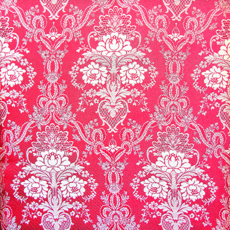 Red vintage fabric with gold decorの写真素材