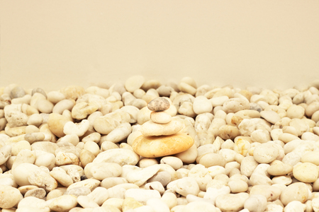 Stack of round smooth stones on a seashoreの写真素材
