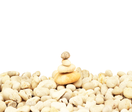 Stack of round smooth stones on a seashoreの写真素材