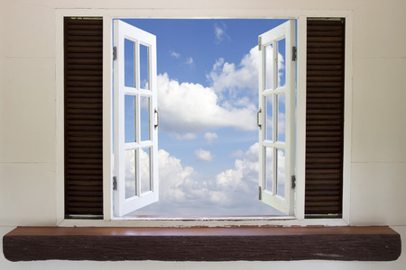 Open window in the sky,Open window against a wall the sky and cloudの写真素材