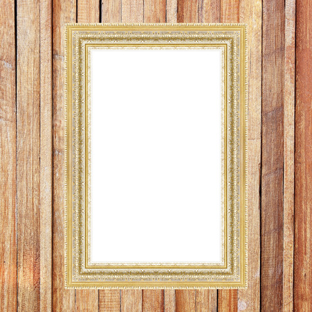 Antique gold frame on wooden wallの写真素材