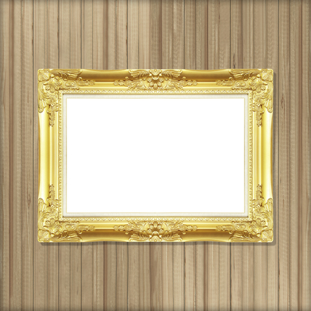 Antique gold frame on wooden wallの写真素材