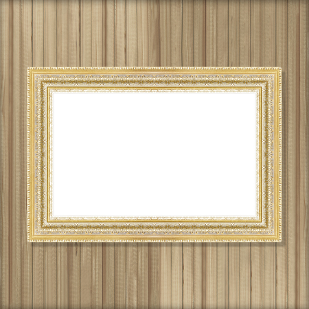 Antique gold frame on wooden wallの写真素材