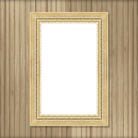 Antique gold frame on wooden wall の写真素材