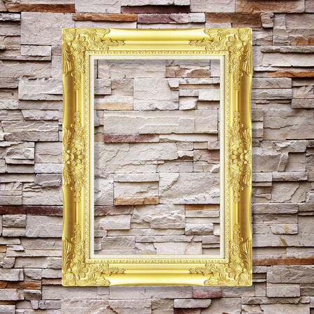 Antique frame on stone wall backgroundの写真素材