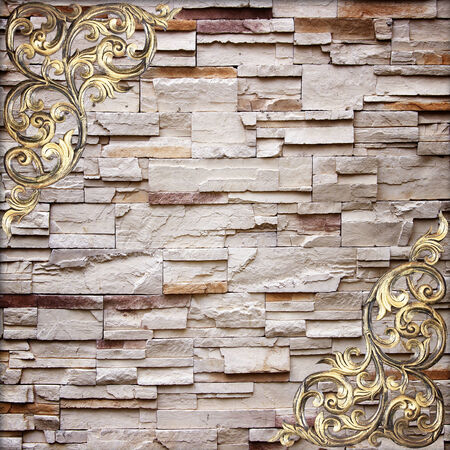 Pattern of wood carve flower on stone wall background の写真素材