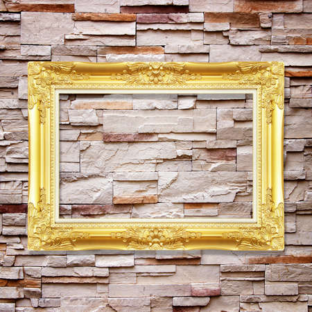 Antique frame on stone wall background の写真素材