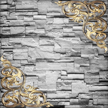 Pattern of wood carve flower on stone wall backgroundの写真素材
