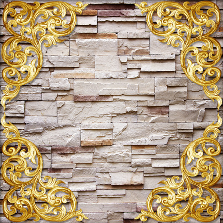 Pattern of wood carve flower on stone wall background の写真素材