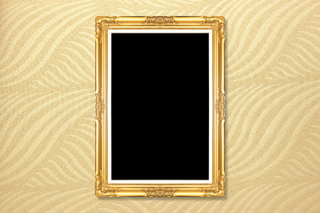 Empty golden vintage frame on wallpaper backgroundの写真素材