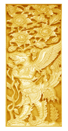 Traditional Thai style wood carving on the wall of Temple in Thailandの写真素材