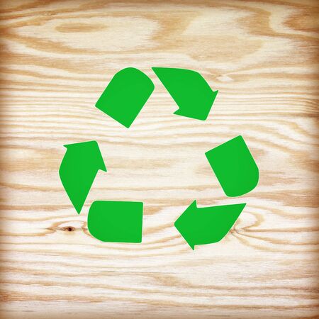 wooden texture with recycle symbolの写真素材