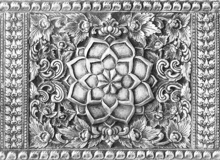 Silver carving art on the walls temple in Thailand.の写真素材