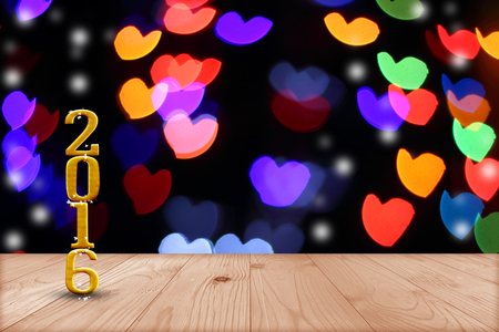2016 year.  in perspective wood with blur bokeh wall and wooden plank floor