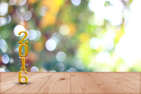 2016 year.  in perspective wood with blur bokeh wall and wooden plank floorの写真素材