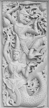 Traditional Old wood carving on the wall of Temple in Thailand,  Thai styleの写真素材