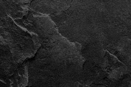 Dark grey black slate stone background or textureの写真素材