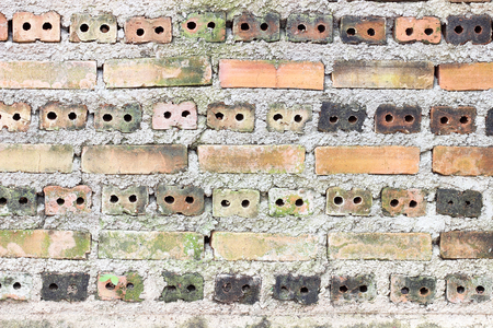 Old weathered brick wall fragment texture backgroundの写真素材