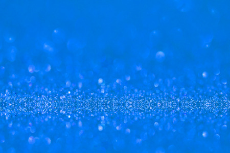 blue glitter texture christmas abstract background, Defocused abstract blue glitter texture backgroundの写真素材