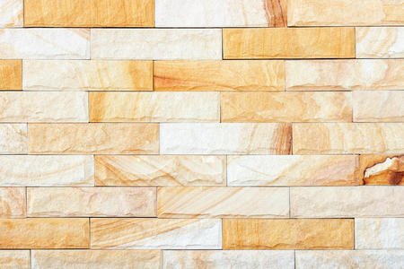 Sandstone yellow wall texture for background.の写真素材