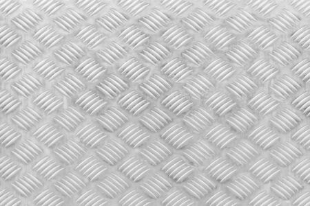 Texture of a metal diamond plate for background.の写真素材