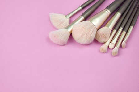 Make up brush lie on a marble background.