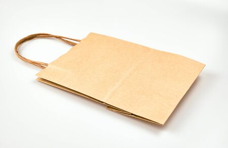 Delivery of food grocery brown bag on the doorstep for protect Corona virus spreading of safety. Precaution measures against COVID-19, paper bag delivered without contact.の写真素材