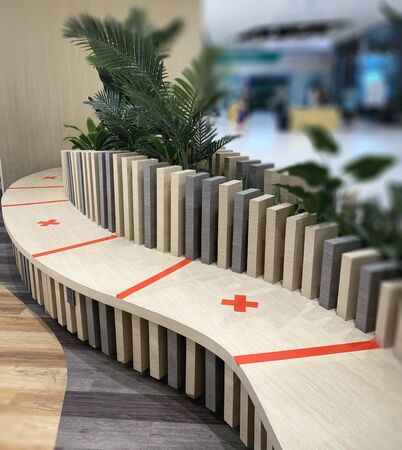 Red symbol to sit at shopping mall. Social distancing with COVID-19 coronavirus crisis.