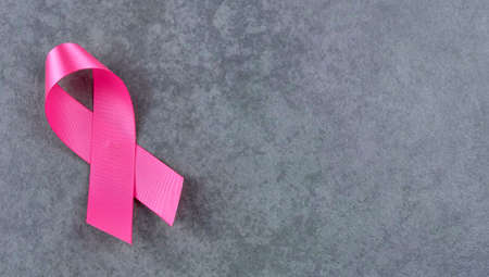 Breast cancer awareness pink sign symbol on isolated grey background. healthcare and medicine...