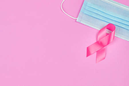 Breast cancer awareness pink sign symbol on isolated grey background. healthcare and medicine concept.の写真素材