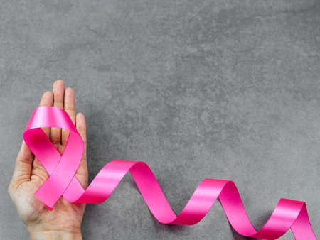 Breast cancer awareness pink sign symbol on isolated grey background. healthcare and medicine concept.の写真素材