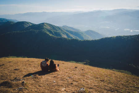 A couples look over the mountain viewの写真素材