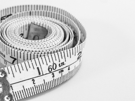 plastic tape measure on a white backgroundの写真素材