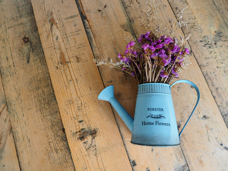 Artificial flower, home decoration, on wooden table.の写真素材