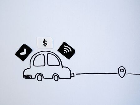 A drawing car and small paper simulated as a SIM card. Dollar, wifi and heart symbol on paper sim cardsの写真素材