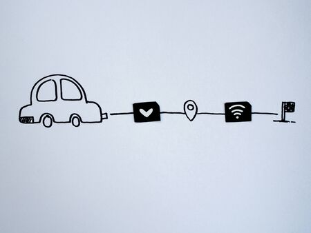 A drawing car and small paper simulated as a SIM card. Dollar, wifi and heart symbol on paper sim cardsの写真素材