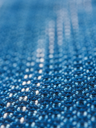 Close-up strip line blue indigo woven fabric pattern texture backgroundの写真素材