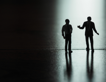 Miniature businessman silhouette, business and technology conceptの写真素材