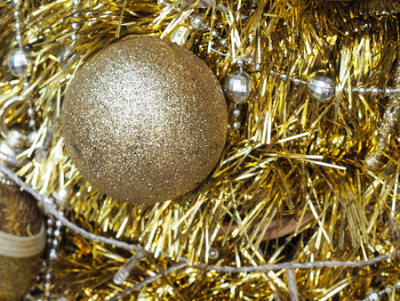 Golden glitter Christmas ball decoration. Christmas and Happy New Year conceptの写真素材