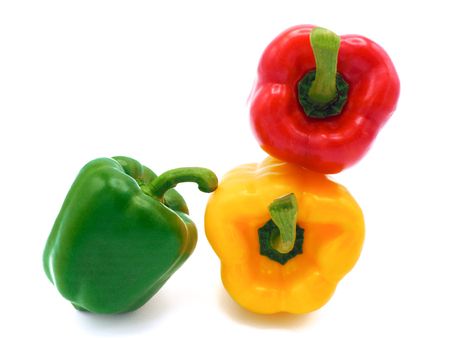 Fresh vegetables, red, yellow, green sweet peppers on white background.の写真素材